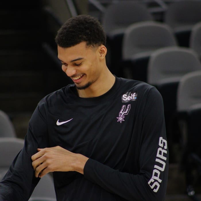 Jan 4, 2024; San Antonio, Texas, USA; San Antonio Spurs rookie Victor Wembanyama (1) smiles while listening to fans sing him 'Happy Birthday' prior to facing the Milwaukee Bucks.